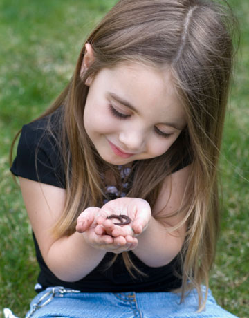 Girl with worm in the Garden.